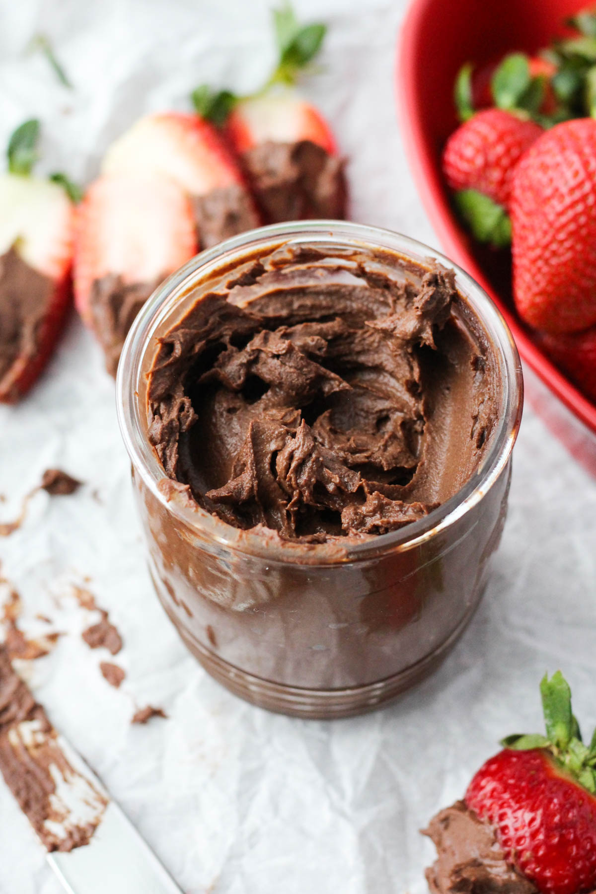 Super thick and creamy nut free chocolate spread in a glass mason jar.