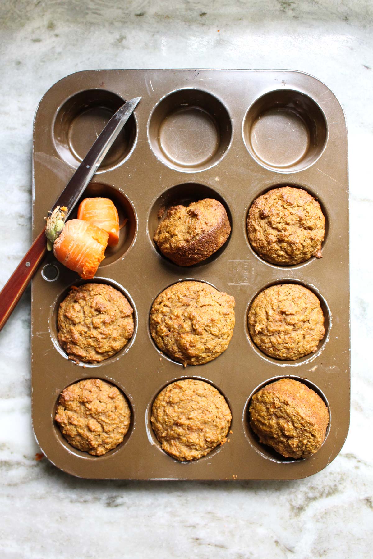 Carrot cake muffins in muffin tin.