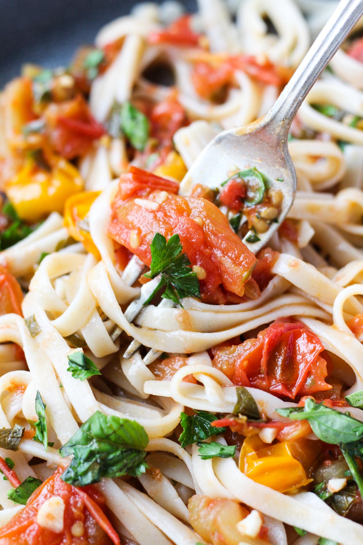 Fork twirling spaghetti with sauce.