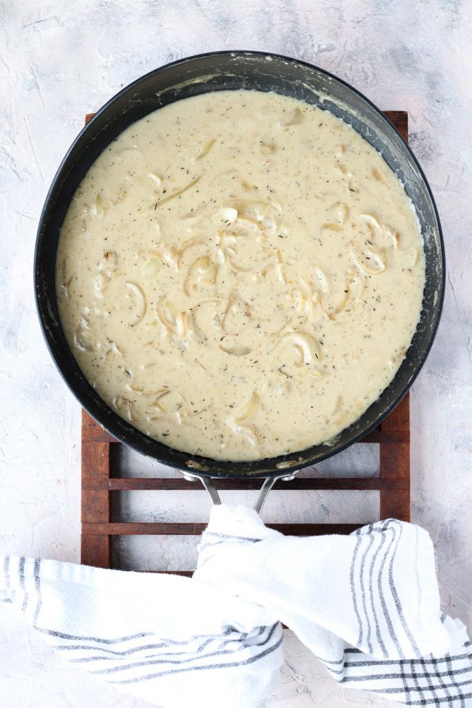 Cream sauce in frying pan.