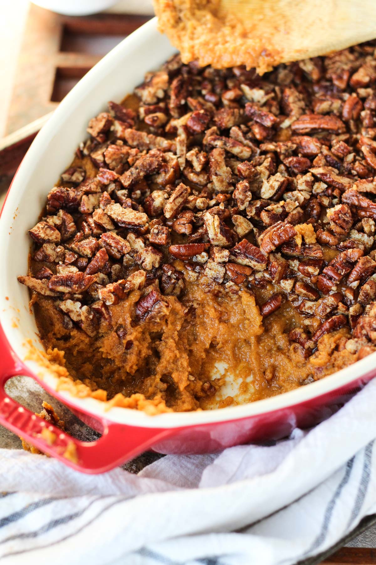 Sweet potato casserole with some scooped out.