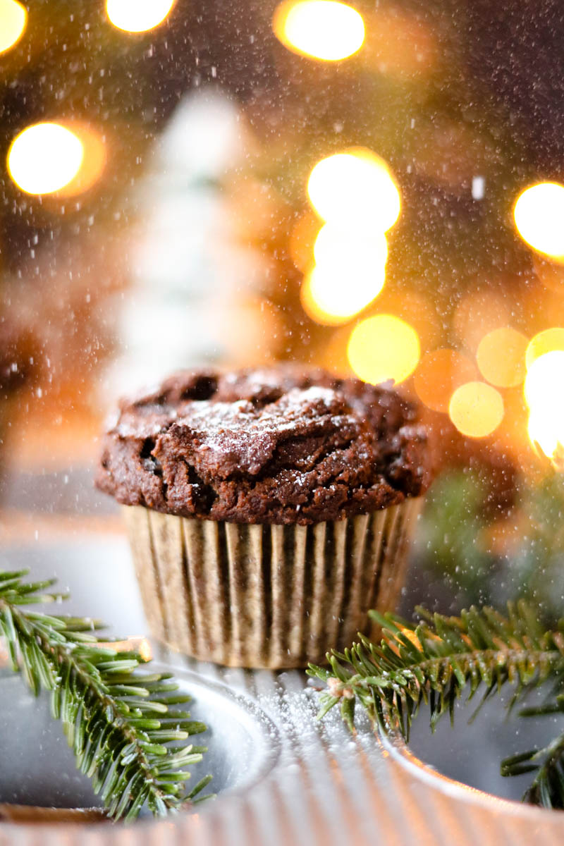 Gingerbread muffin with powdered sugar sprinkled on top.
