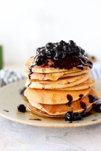 Cassava flour pancakes with blueberries on top.