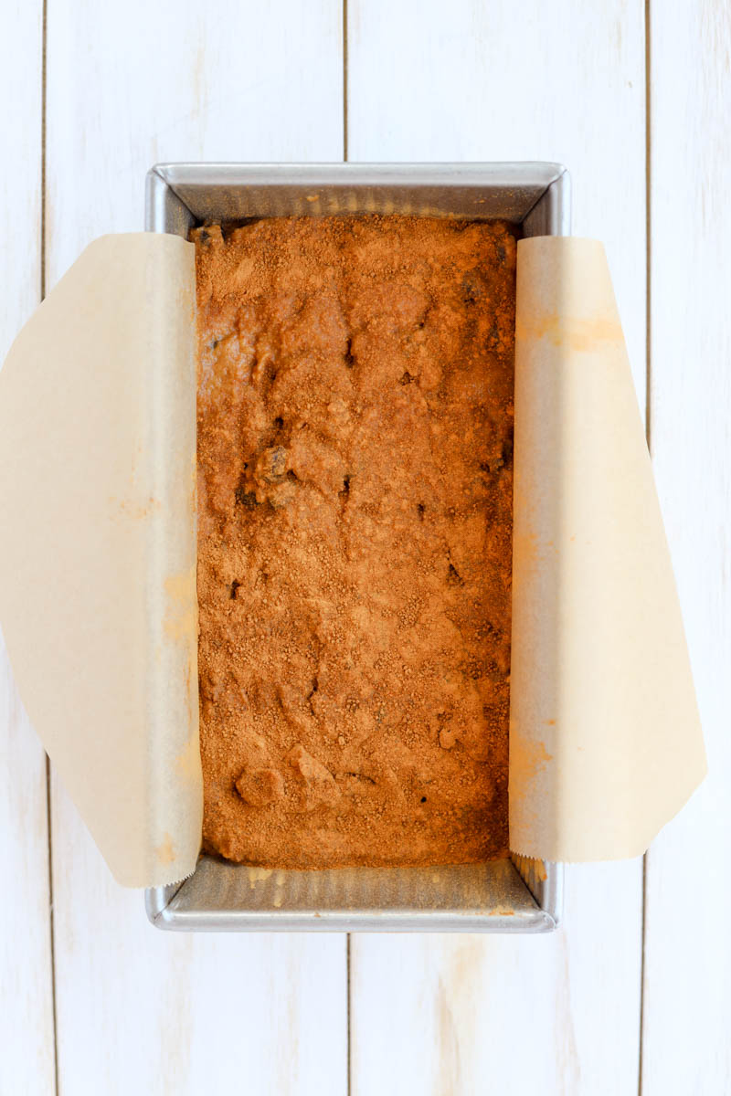 Cinnamon raisin bread in pan before being baked.