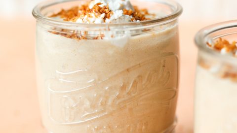 Glass jar with toasted coconut milkshake.