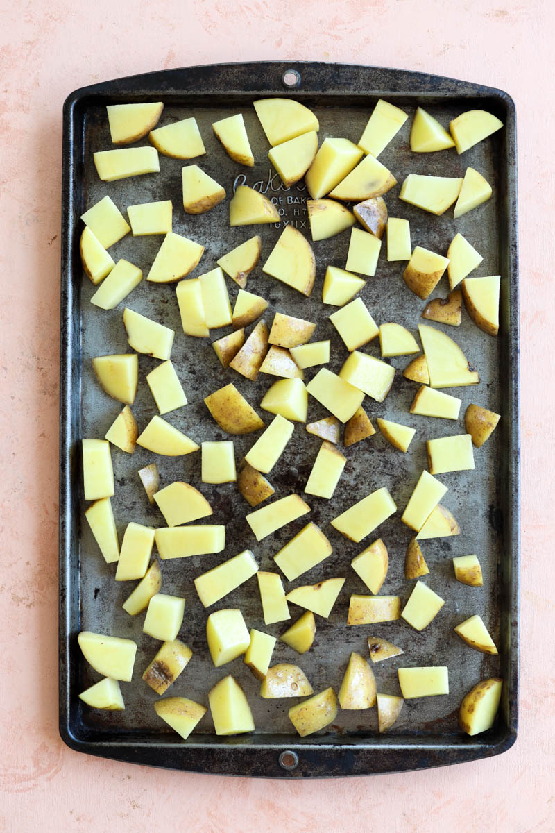 Potatoes on a baking sheet.