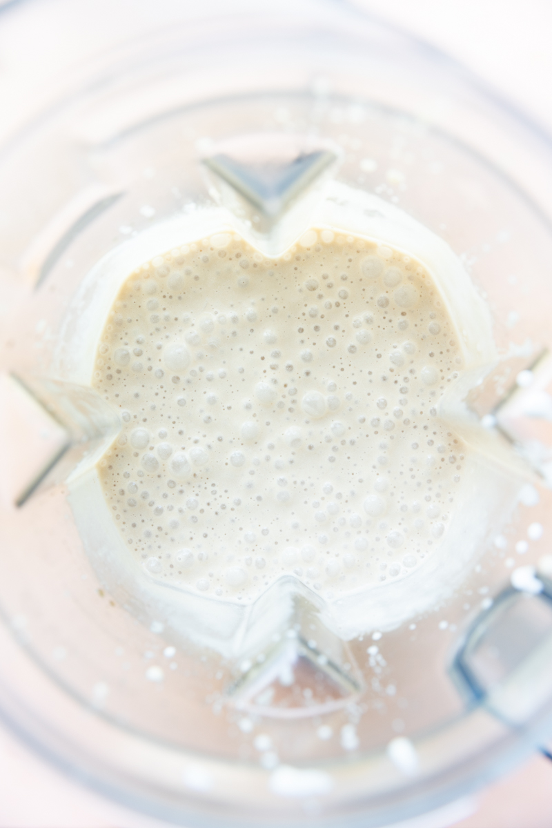 Creamy coffee milkshake in blender.