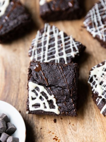 Halloween brownies with a white chocolate spider web.