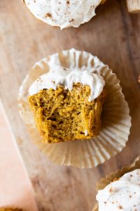 Pumpkin protein muffin with a big bite taken out.