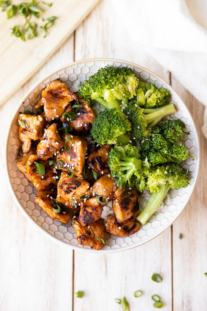Golden brown salmon rice bowls with broccoli.