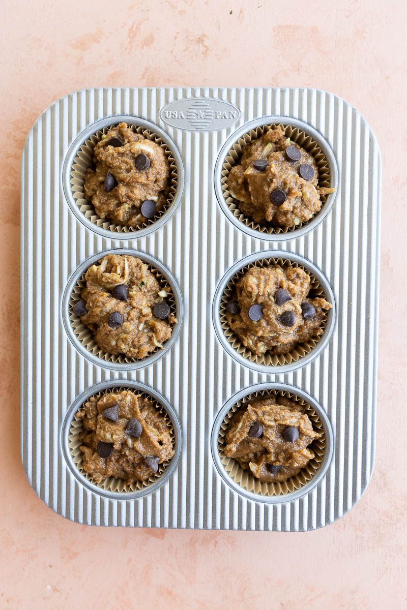 Healthy zucchini muffins in a baking pan.