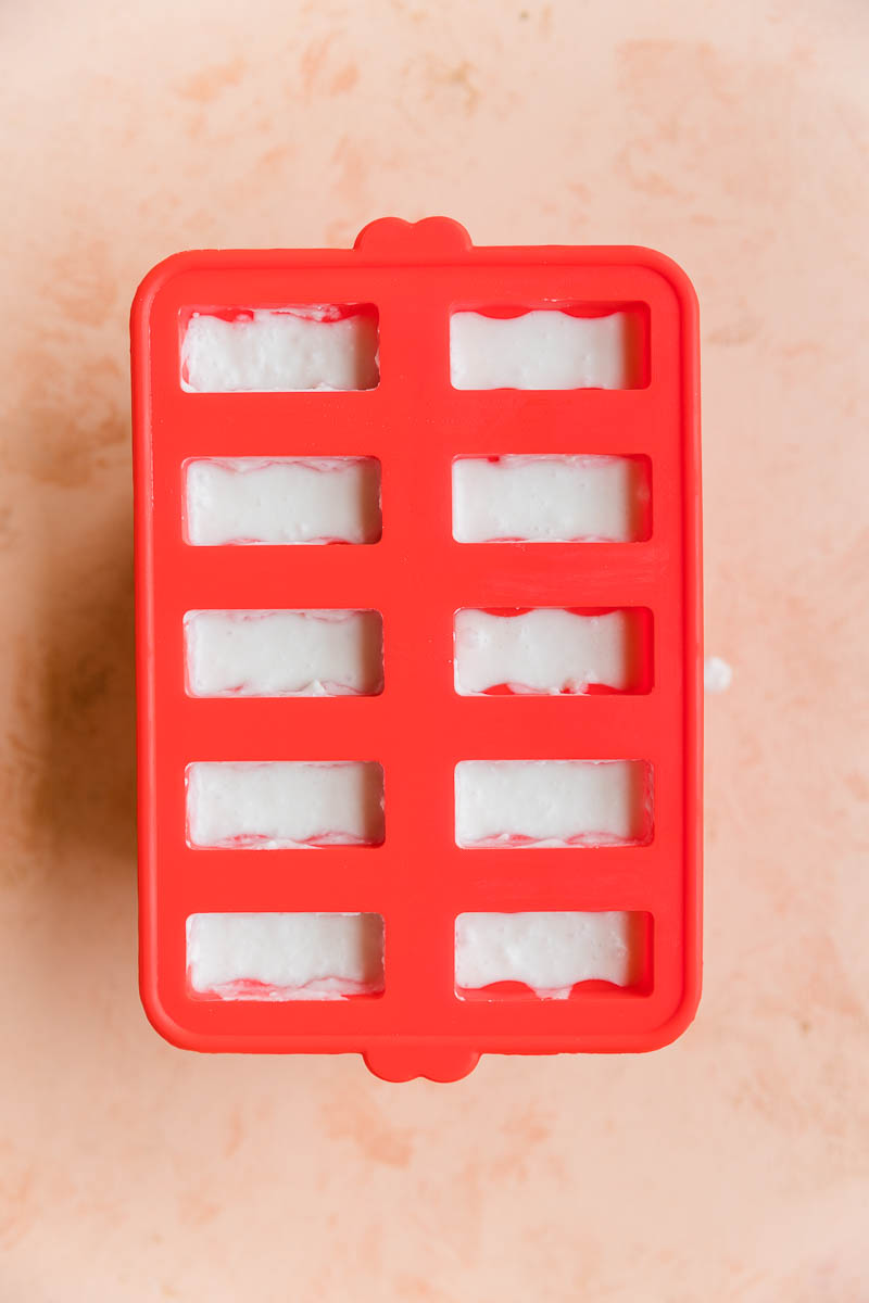 Coconut ice cream bars in silicone mold.