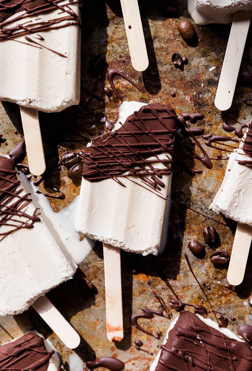 Coffee popsicles with chocolate on top.