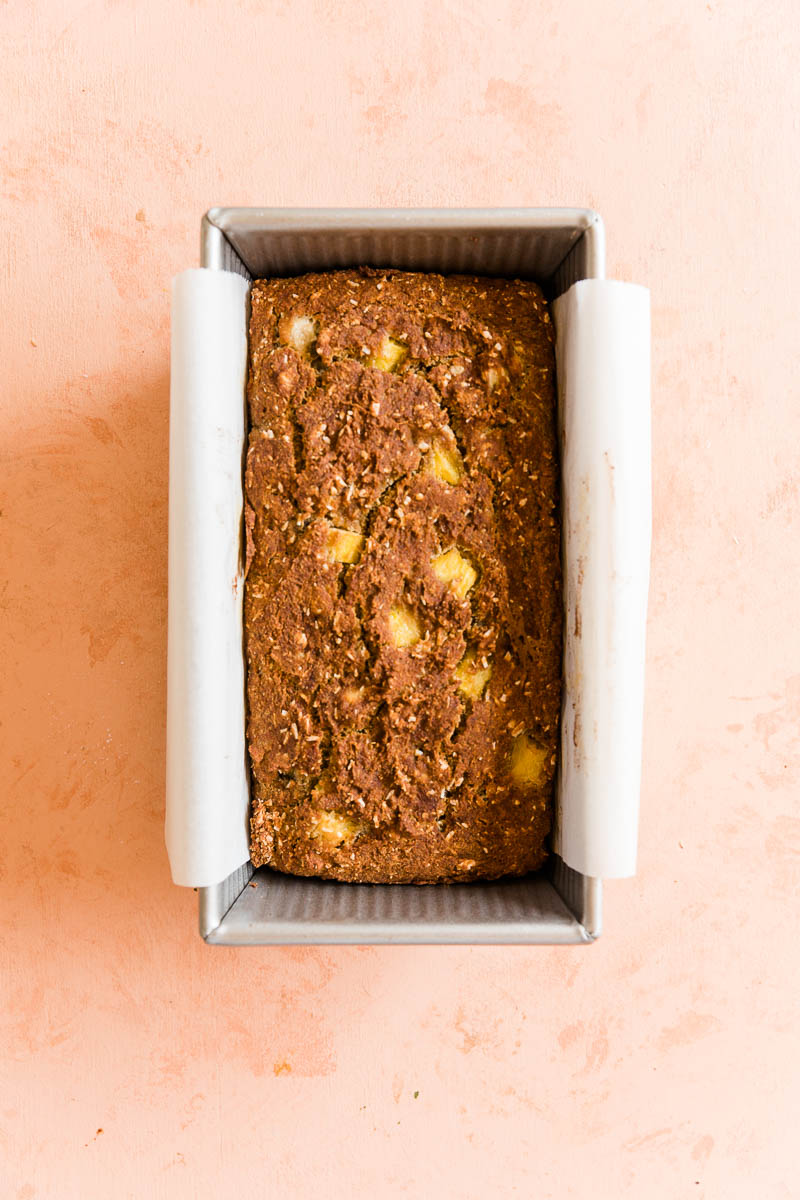 Baked pineapple banana bread in pan.