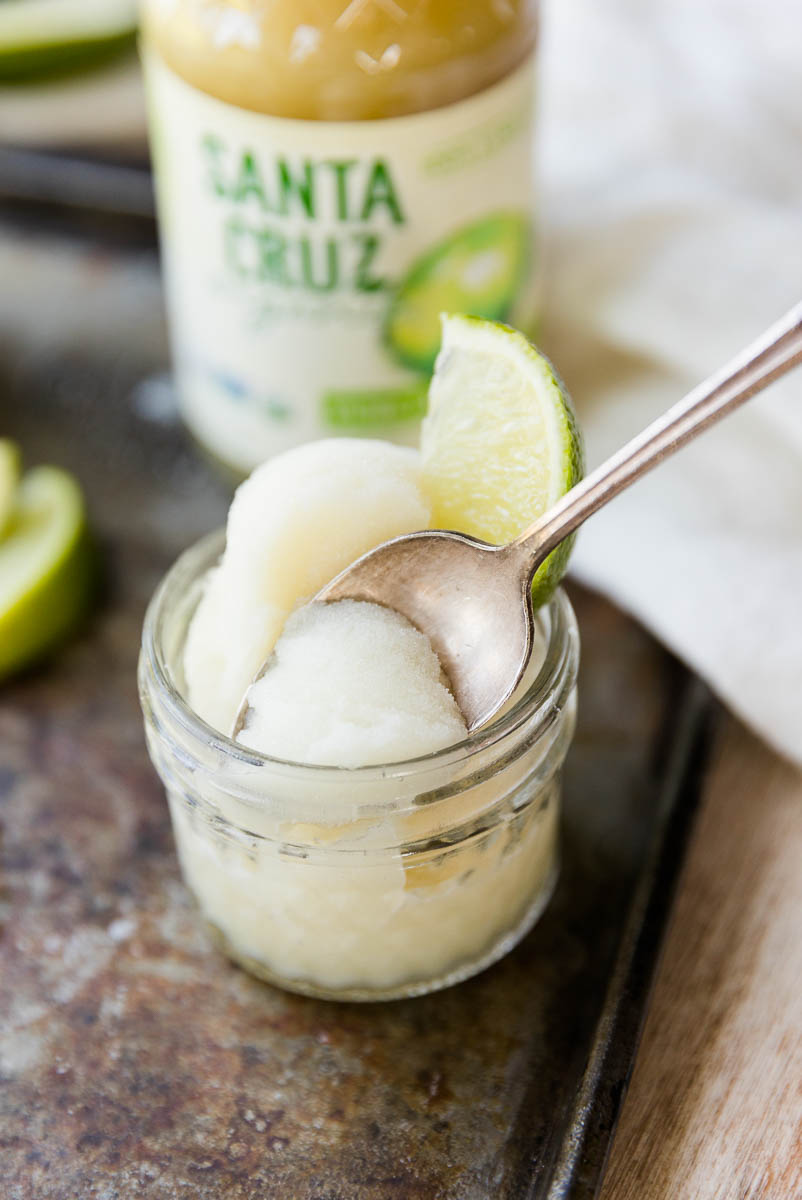 Spoon scooping out lime sorbet.