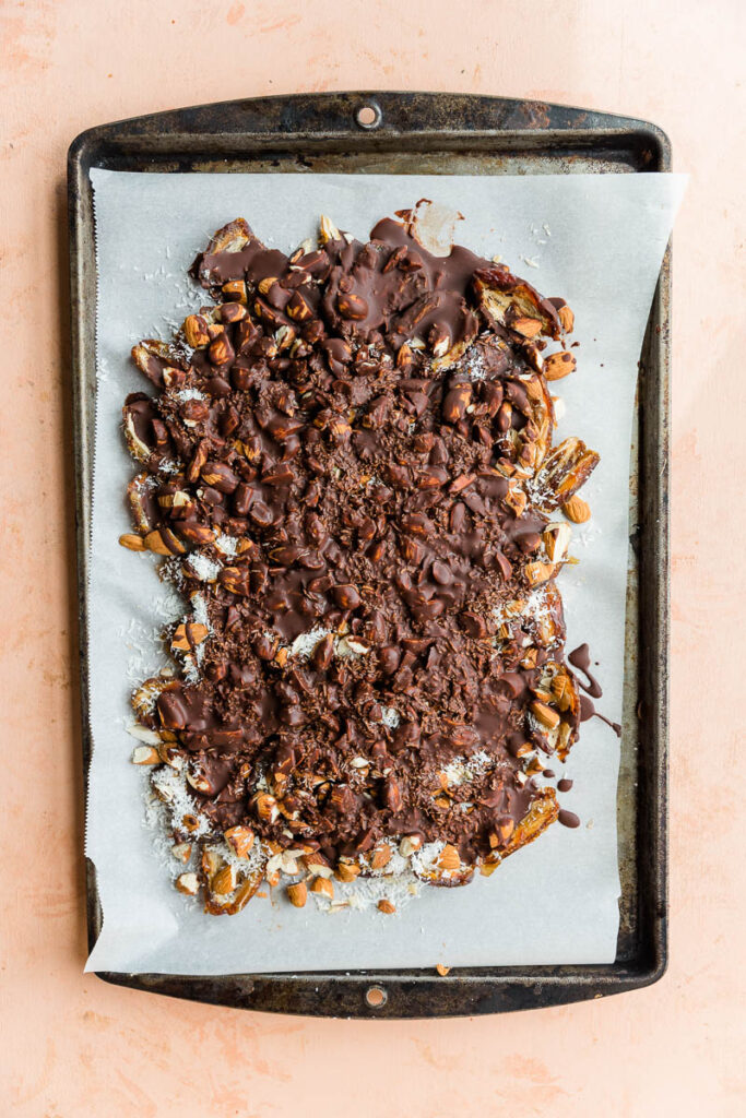 Melted chocolate covering date bark.