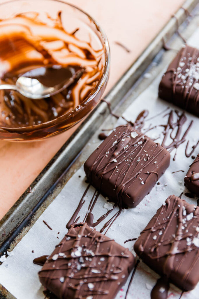 Chocolate ice cream bars with flaky sea salt on top.