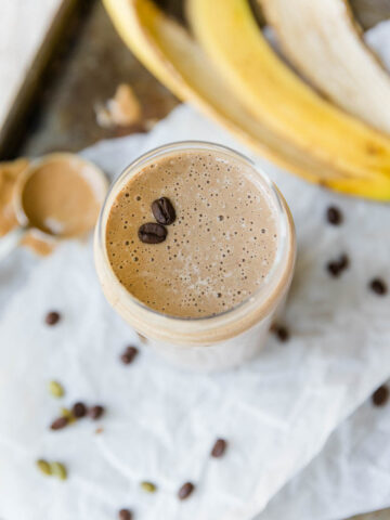 Banana coffee smoothie in glass cup.