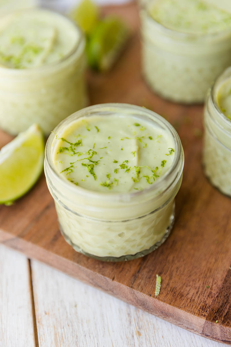 Creamy avocado pudding with fresh lime zest on top.