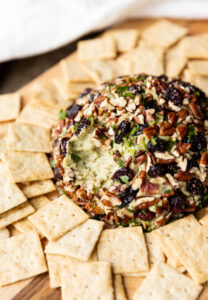 Vegan cheese ball with a bite taken out.