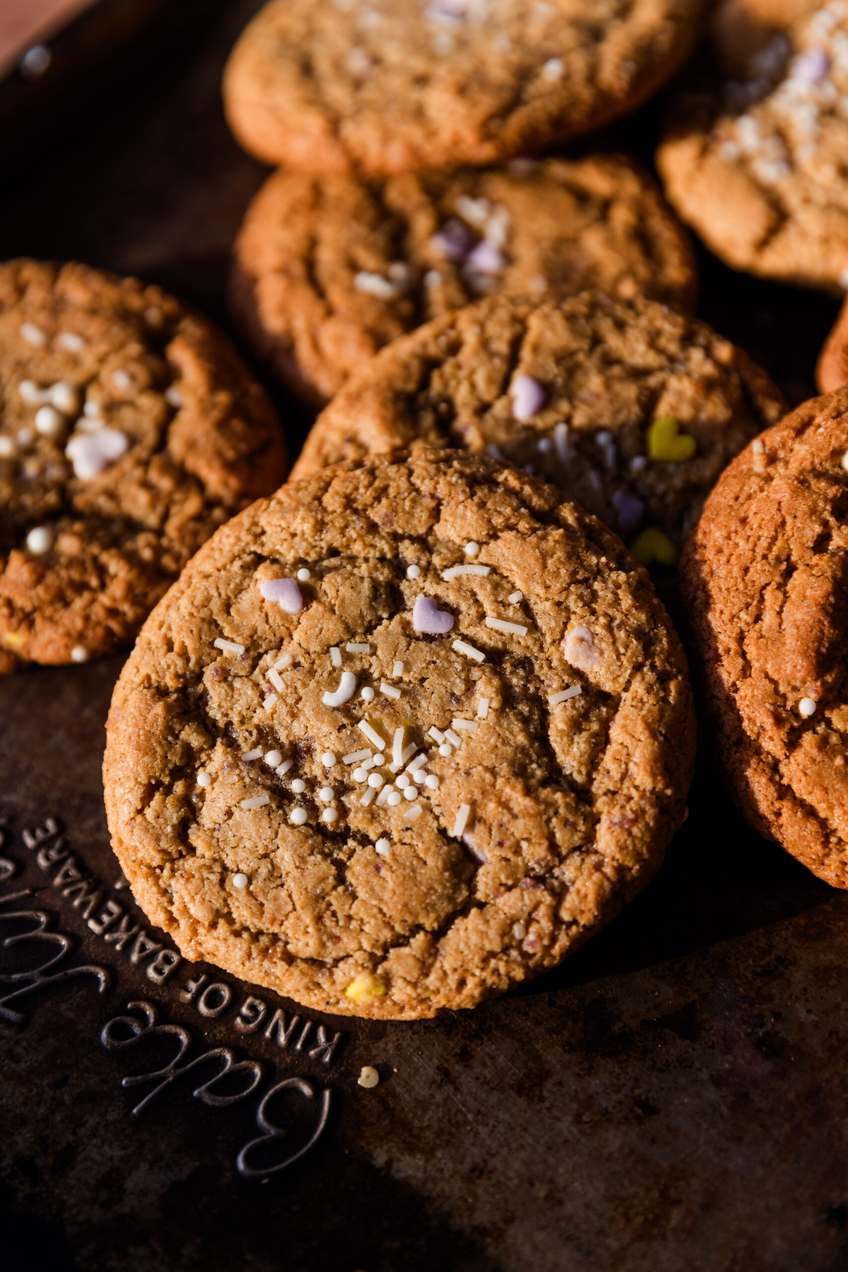 Soft and chewy gluten free sugar cookies on baking sheet.