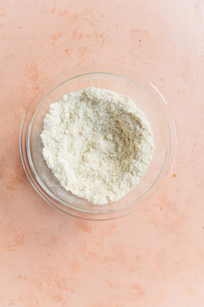 Dry ingredients in glass mixing bowl.