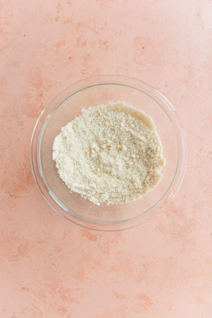 Dry ingredients in glass mixing bowl.