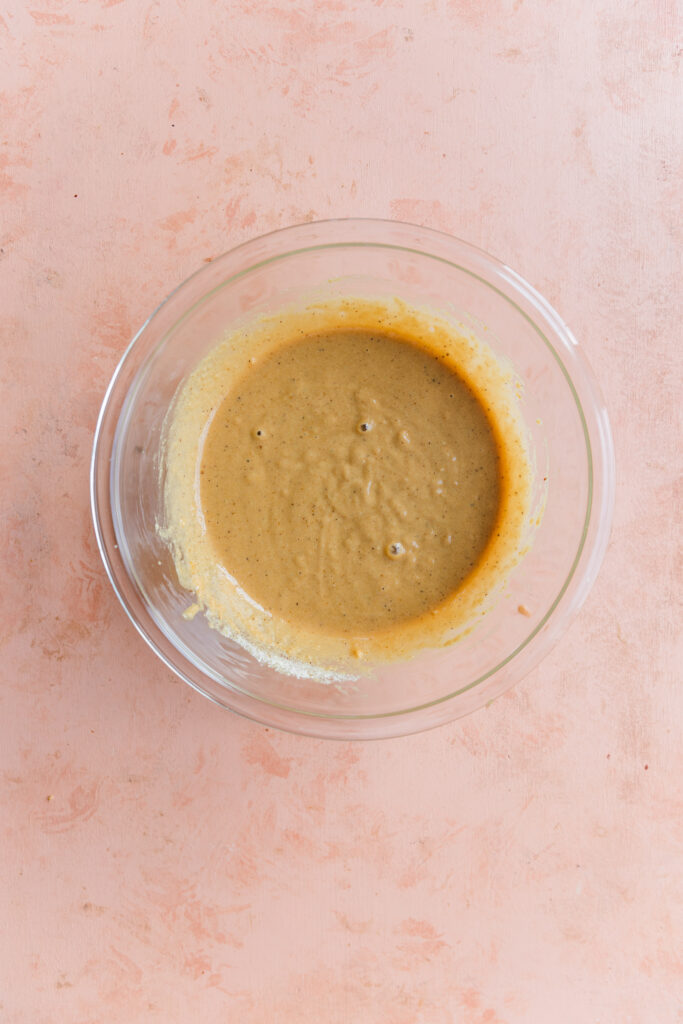 gluten-free vanilla cake batter in glass mixing bowl.