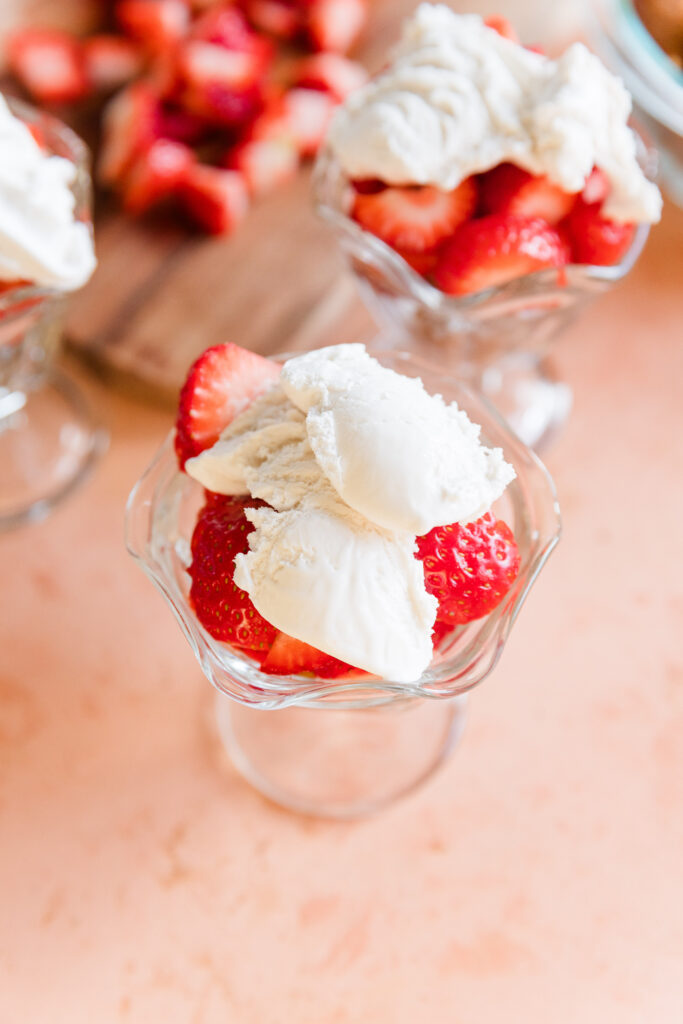 Coconut whipped cream on top of the strawberry shortcake cups.