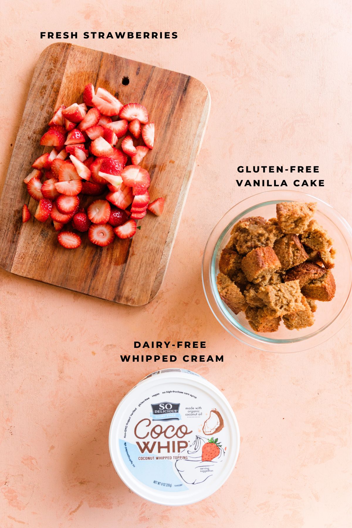 Cubed vanilla cake, fresh strawberries, and coconut whipped cream.