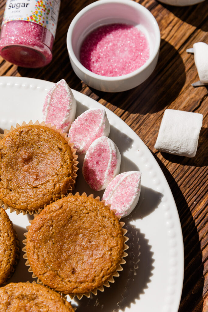 Close up picture of pink sprinkles on marshmallows to create bunny ears.