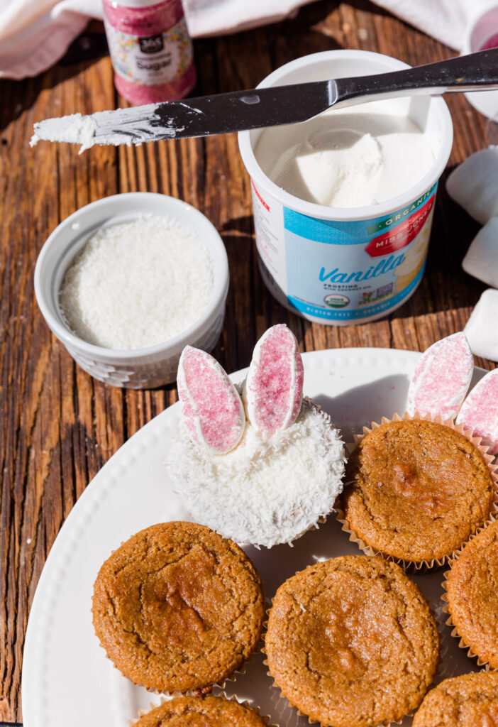 Vanilla cupcake frosted and dipped in shredded coconut to create the bunny look with marshmallow bunny ears.
