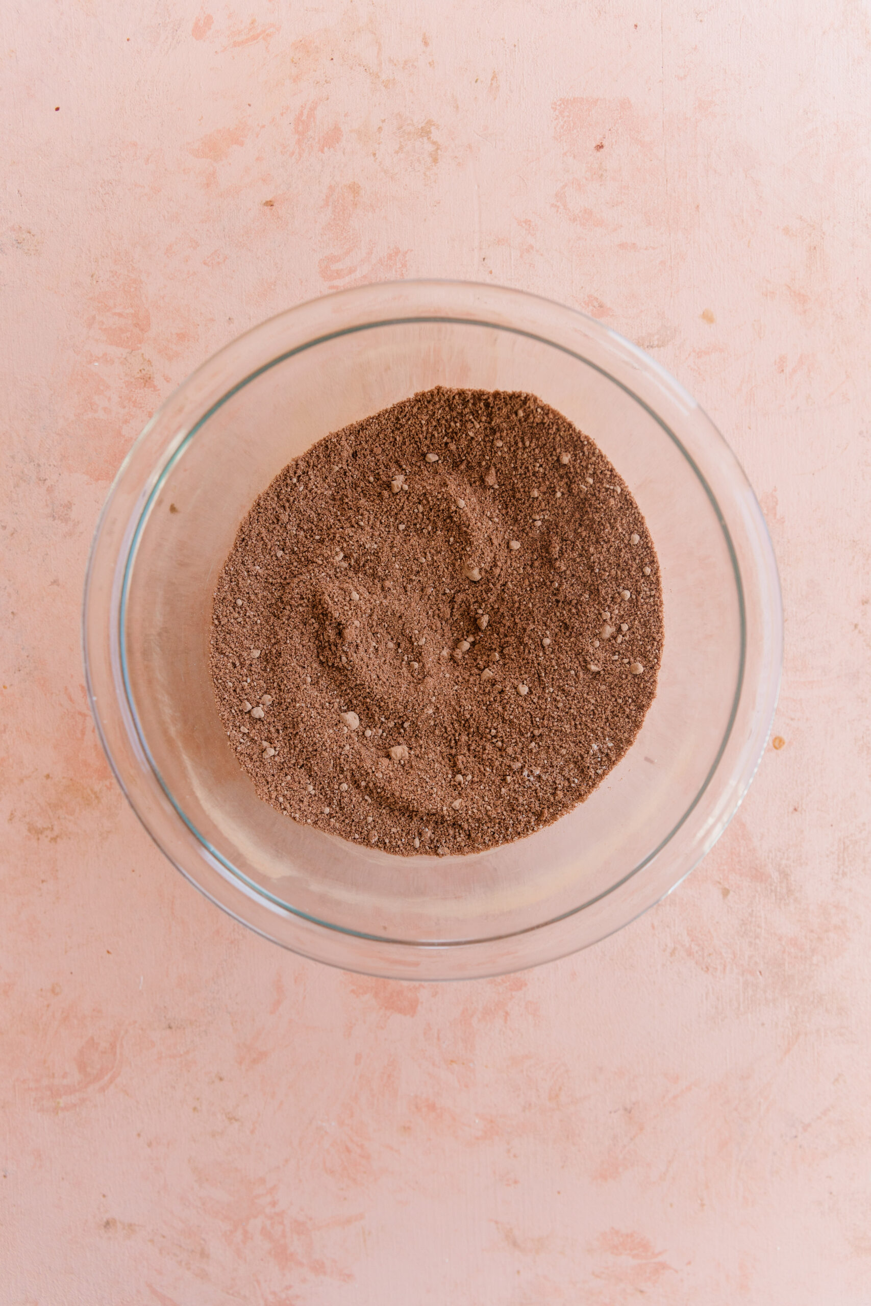 Dry ingredients in glass mixing bowl.