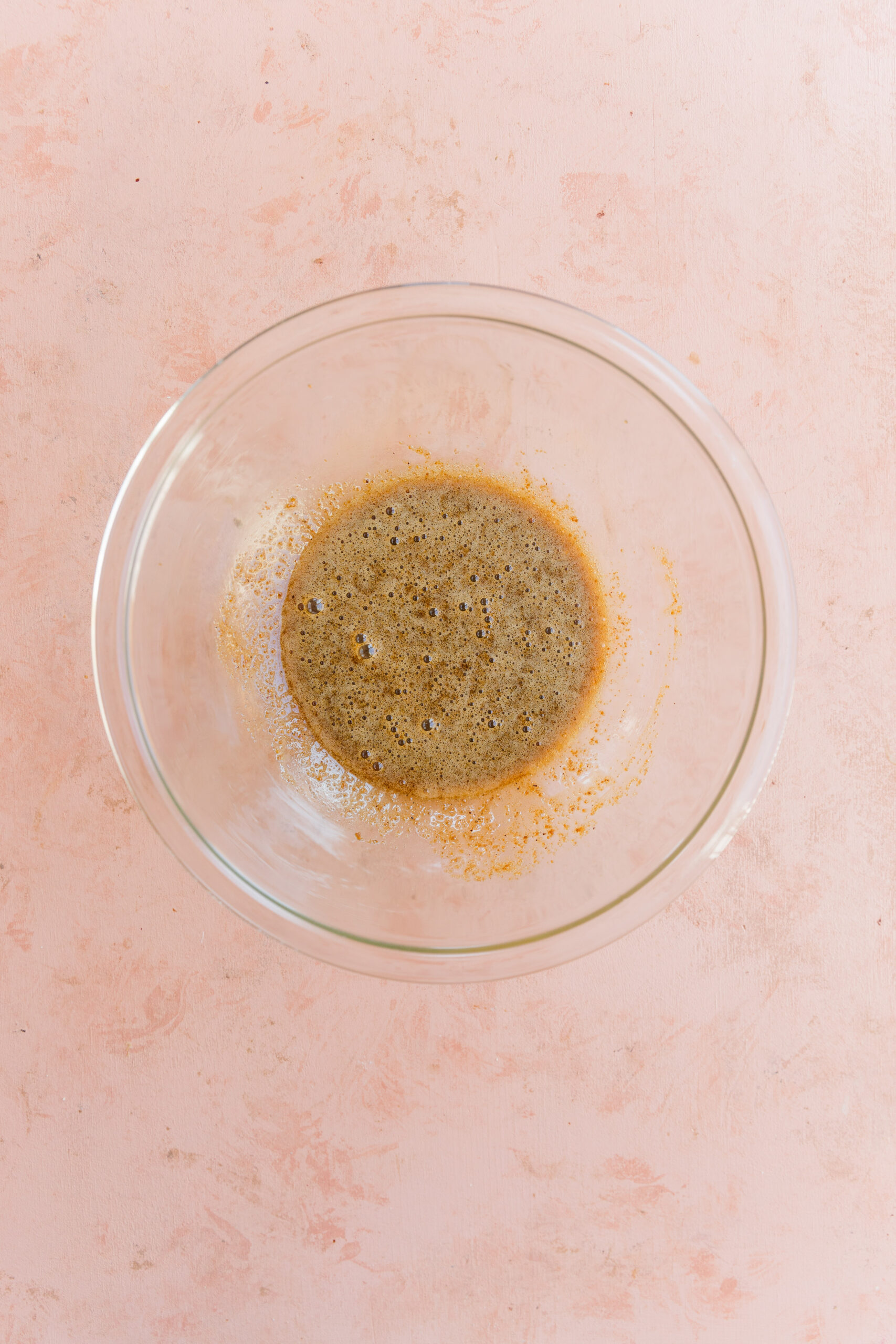 Wet ingredients in glass mixing bowl.
