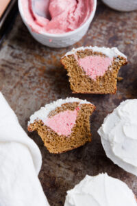 Pink gender reveal vanilla cupcakes.